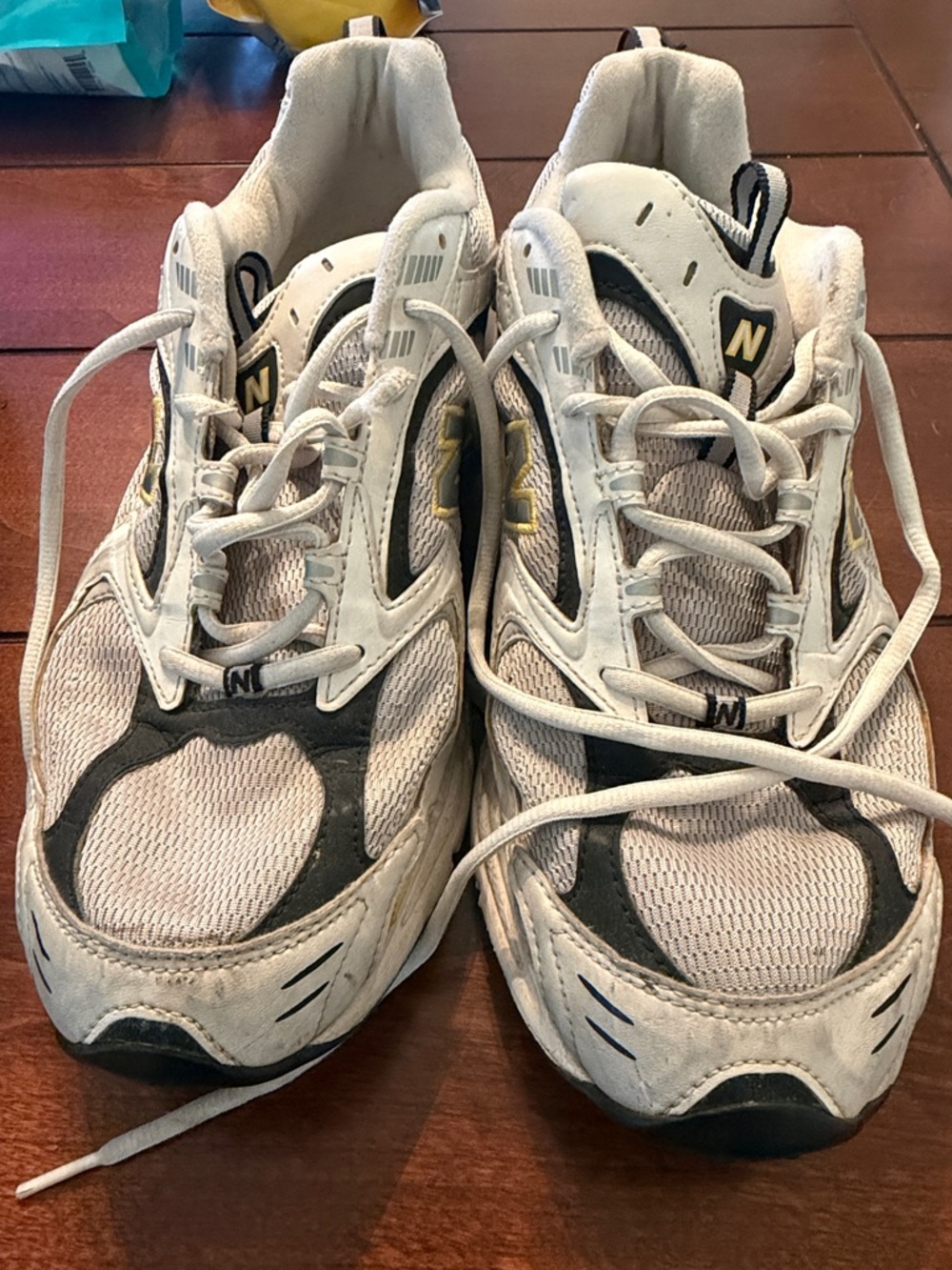 New Balance White, Black and Gold Athletic Sneakers